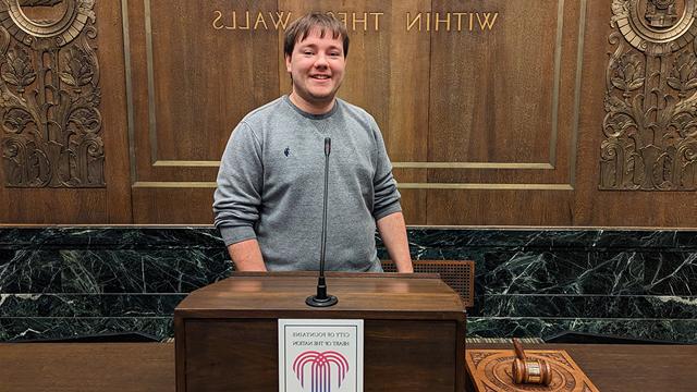 Josh Haverkamp standing at a podium