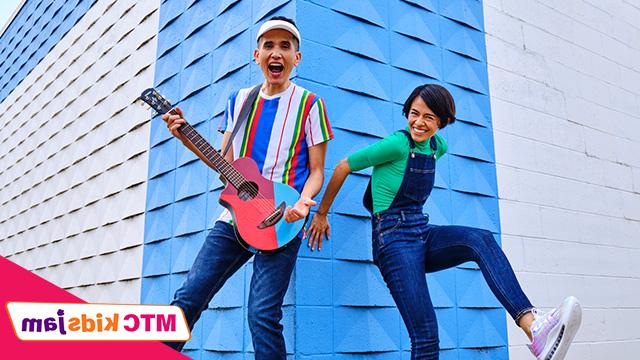 Christina and Andrés standing in front of a building